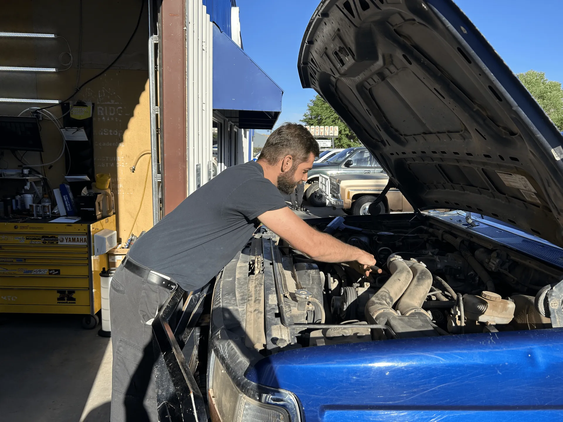 Inside the Chapman's Automotive shop in Craig, Colorado, a pickup truck on the lift